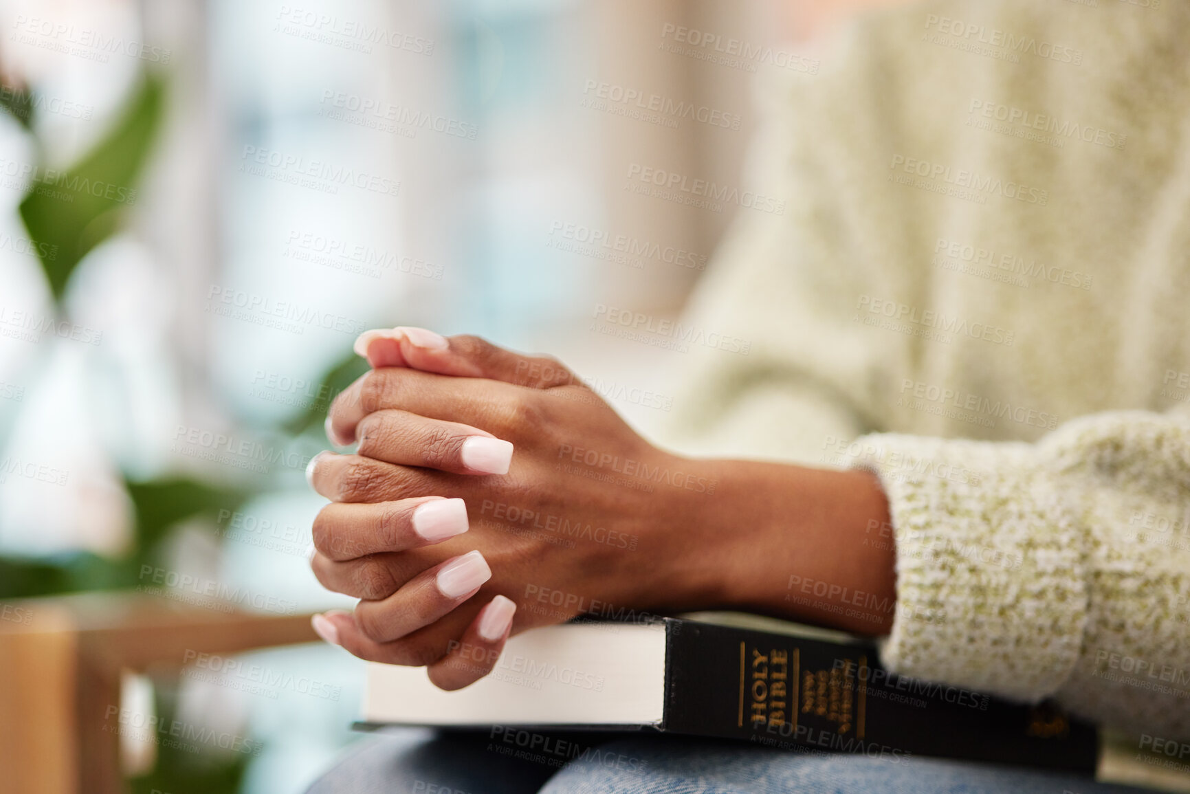 Buy stock photo Hands, bible and woman praying for help, faith or gratitude to God, praise and humble in her home. Jesus, worship and lady person in prayer for religious, hope or trust, Christian and spiritual guide