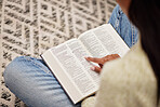 Closeup, hands and woman with a bible, spiritual and religion for peace, guidance and learning. Zoom, female person or worship with praise, reading scripture and gratitude with prayer, home and relax