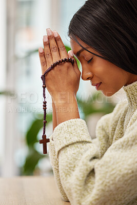 Praying, hands and Indian woman with a rosary in her home for worship, praise and gratitude to God. Jesus, pray and female with crucifix and prayer for hope, trust and Christian, faith or guidance