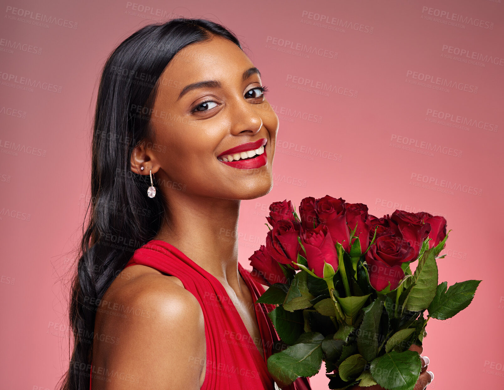 Buy stock photo Happy, beauty and portrait of a woman with a rose on a studio background for valentines day. Makeup, model and face of a young Indian girl with a flower bouquet for romance or love on pink backdrop