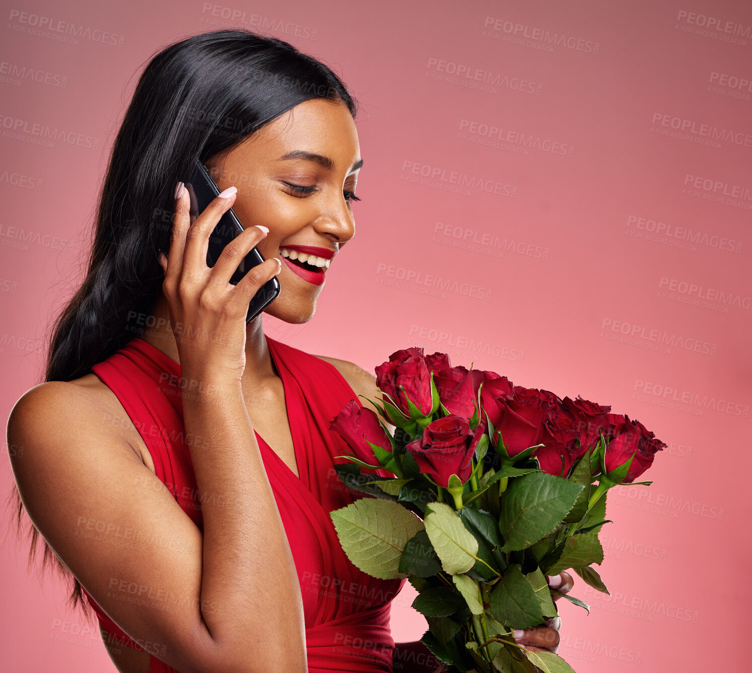 Buy stock photo Phone call, talking and a woman with roses on a studio background for valentines day. Thank you, model and face of a young Indian girl with a flower bouquet and smartphone for romance or love on pink