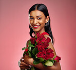 Pageant, flowers and portrait of an Indian woman on a studio background for valentines day. Smile, beautiful and a young model or girl with a floral bouquet on a backdrop for luxury present of roses