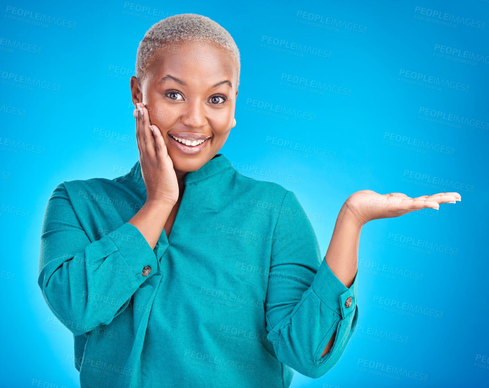 Buy stock photo Portrait, smile and black woman showing, presentation and promotion against a blue studio background. Face, female person or model with discount deal, option and choice with decisions and advertising