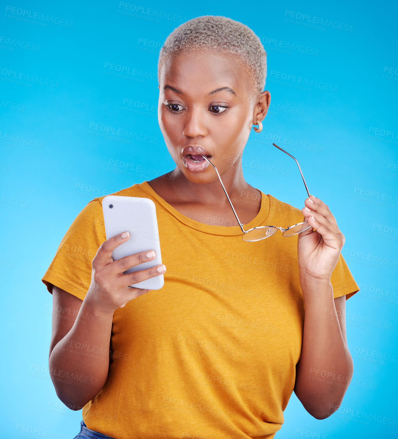 Buy stock photo Shocked, wow and woman reading phone for fake news, wrong email and mistake or scam email. Surprise, stress and african person or online user, social media or mobile problem in studio blue background