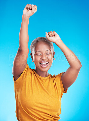 Buy stock photo Winner, dance and happy woman on studio, blue background for excited celebration, energy and success. Winning, yes and young, african person dancing with wow, fist and power, goals or cheers in music