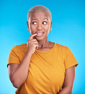 Buy stock photo Black woman, biting nails and anxiety in studio with thinking, confused or ideas for decision by blue background. African girl, stress and finger in mouth for fear, scared or brainstorming for choice