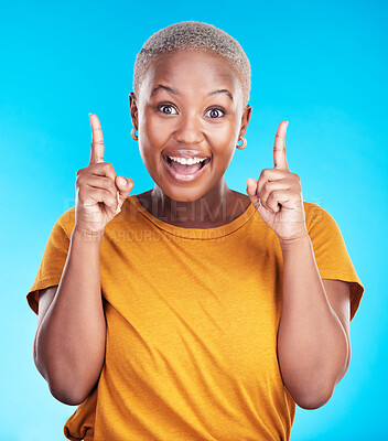 Buy stock photo Excited portrait, pointing up and happy black woman gesture at eureka, problem solving solution or ideas. Wow, OMG notification and African person smile for studio realisation on blue background