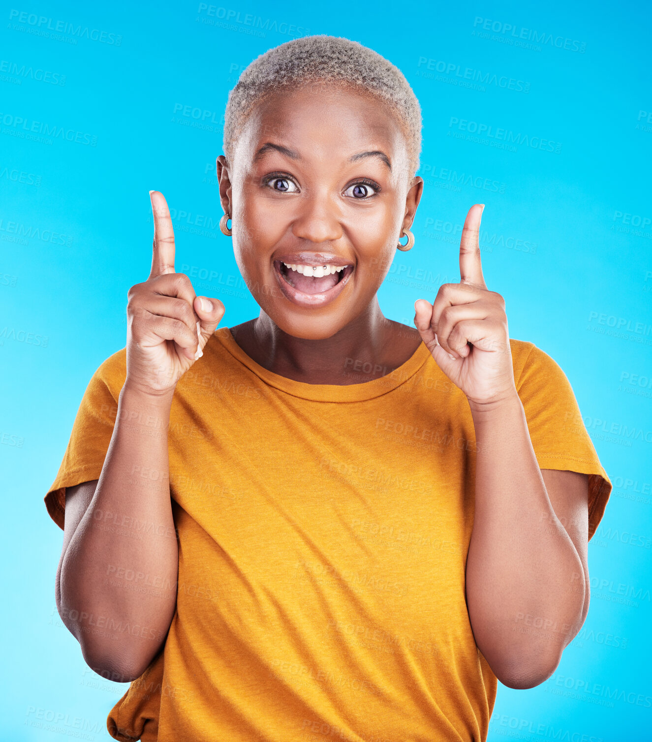 Buy stock photo Excited portrait, pointing up and happy black woman gesture at eureka, problem solving solution or ideas. Wow, OMG notification and African person smile for studio realisation on blue background