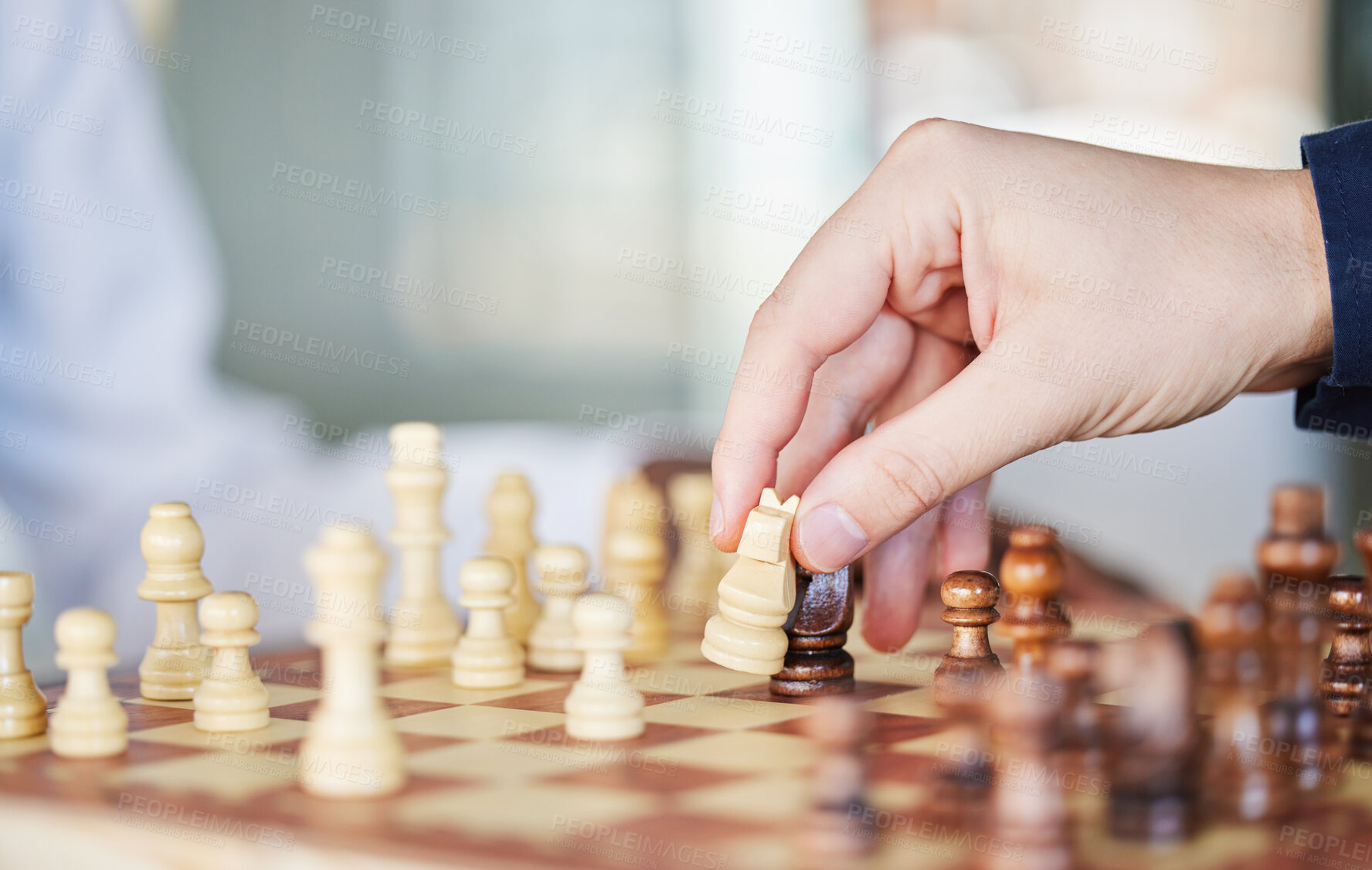 Buy stock photo Playing, board game and chess checkmate with a man at a table while moving piece for strategy or challenge. Hands of a male person to play, relax and bond while moving icon for problem solving or win