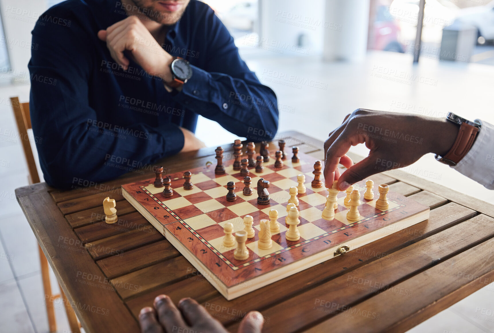 Buy stock photo Hands, competition and people with a chess game, strategy and playing together for fun. Table, professional and friends with a board for gaming, learning and expert with a skill or hobby in a room