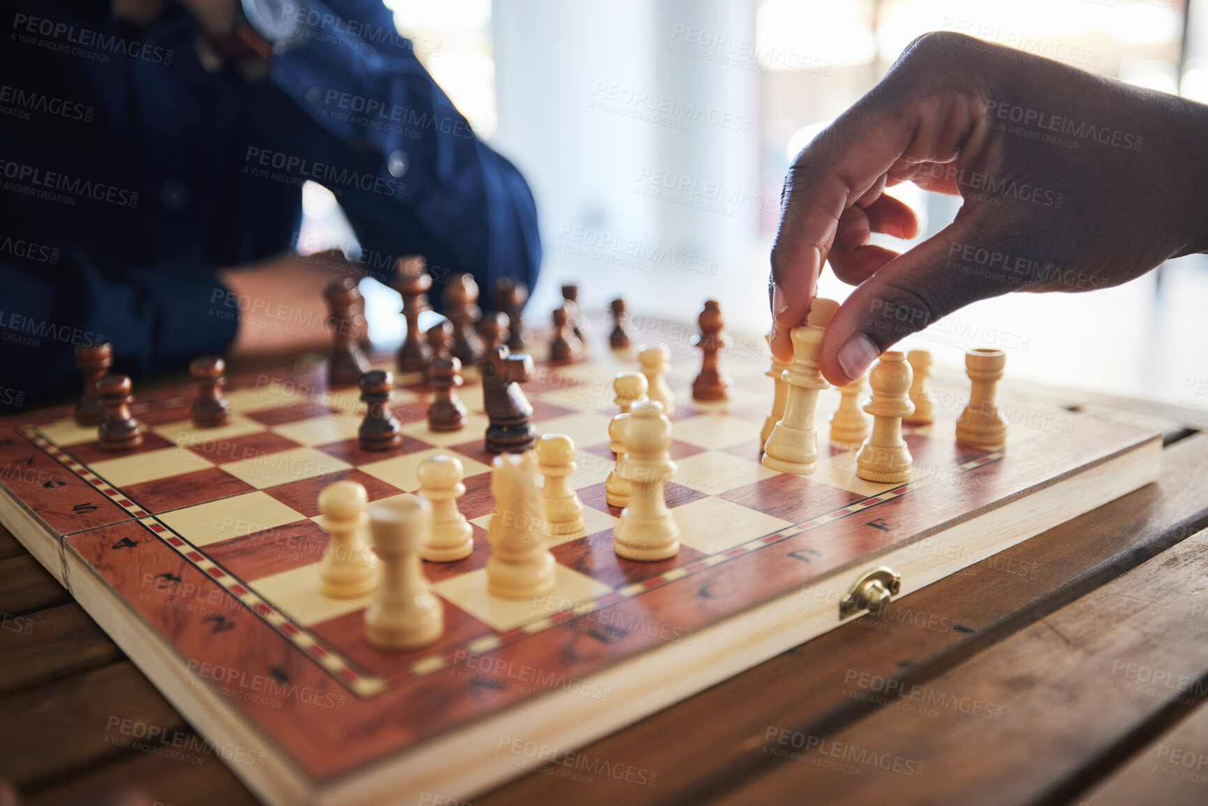 Buy stock photo Hands, fun and people with a chess game, strategy and playing together at a competition. Table, professional and friends with a board for gaming, learning and expert with a skill or hobby in a room