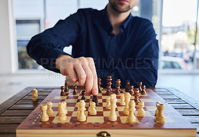 Buy stock photo Chess, man moving a knight and game of strategy, problem solving or person playing on chessboard in competition. Planning, choice and hand on piece or king, queen and player thinking of winning move