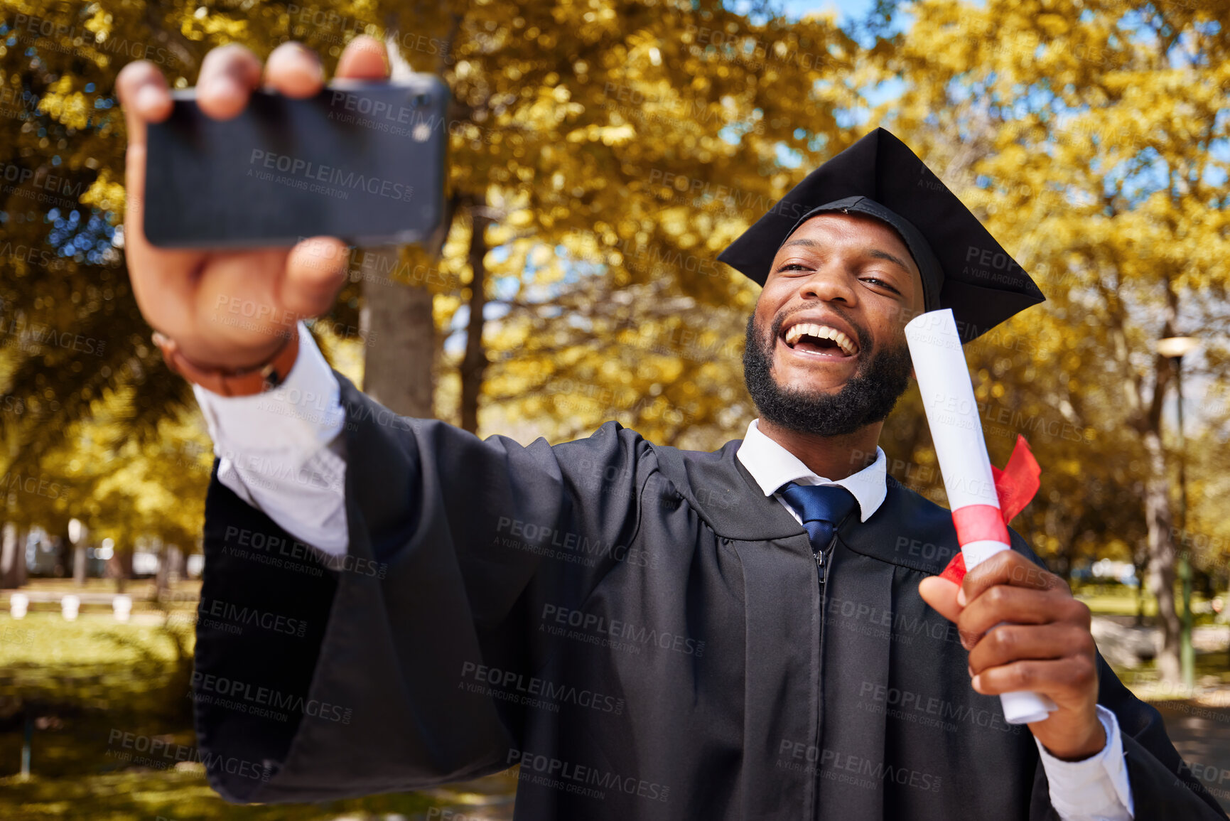 Buy stock photo Graduation selfie, success and student or man on university or college campus, profile picture and diploma or certificate. Graduate, photography and african person in park for scholarship celebration