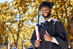 Graduation portrait, thumbs up and man or student on university, education or college campus in diploma success. African person or graduate like, yes and excellence sign, certificate or award in park