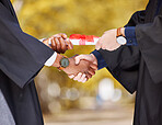 Graduation diploma, handshake and student in success, achievement and congratulations or thank you. Graduate or diversity people shaking hands of certificate, excellence or giving award at university