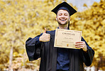 Graduation portrait, certificate and student thumbs up for university, education or college success on campus or park. Excited man or graduate like, yes or excellence emoji and sign, diploma or award