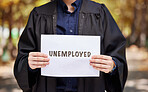 Employment, nature and lawyer with a paper for a job alert, recruitment or law graduate in nature. Showing, unemployed and hands of a legal employee with a sign for a professional legal career