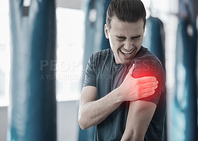 Buy stock photo Hand, shoulder pain and the arm of a man in red highlight during a fitness workout. Healthcare, medical and emergency with a male athlete holding his joint after an accident or injury in the gym