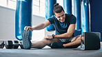 Stretching, fitness and a man with a laptop for exercise tutorial, information or a cardio video. Happy, gym and a male athlete with an online warm up on a computer before training and a workout