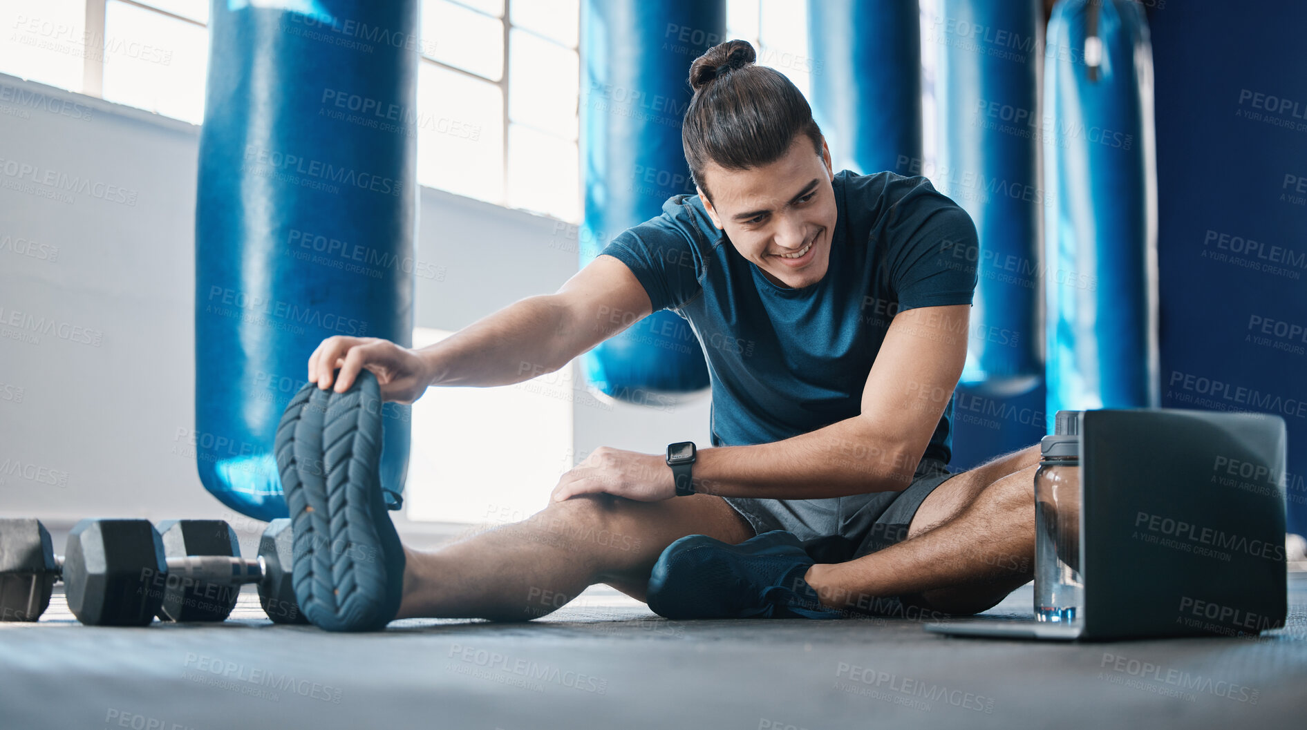 Buy stock photo Stretching, fitness and a man with a laptop for exercise tutorial, information or a cardio video. Happy, gym and a male athlete with an online warm up on a computer before training and a workout