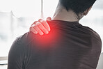 Hand, back pain and injury with the shoulder of a man in red highlight during a fitness workout. Healthcare, anatomy and emergency with a male athlete holding a joint after an accident in the gym