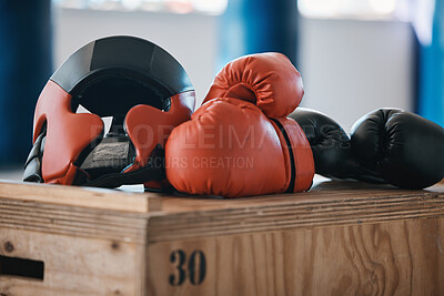 Buy stock photo Gym, equipment and helmet with gloves for boxing fitness, commitment and inspiration in sports training. Kickboxing tools, safety and security in fight exercise, competition goals and fit motivation.