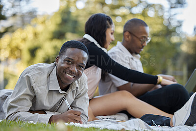 Buy stock photo Black man, student and writing with group in study, project or assignment on grass together in nature. Portrait of happy African male person or learner studying with team for education in the park