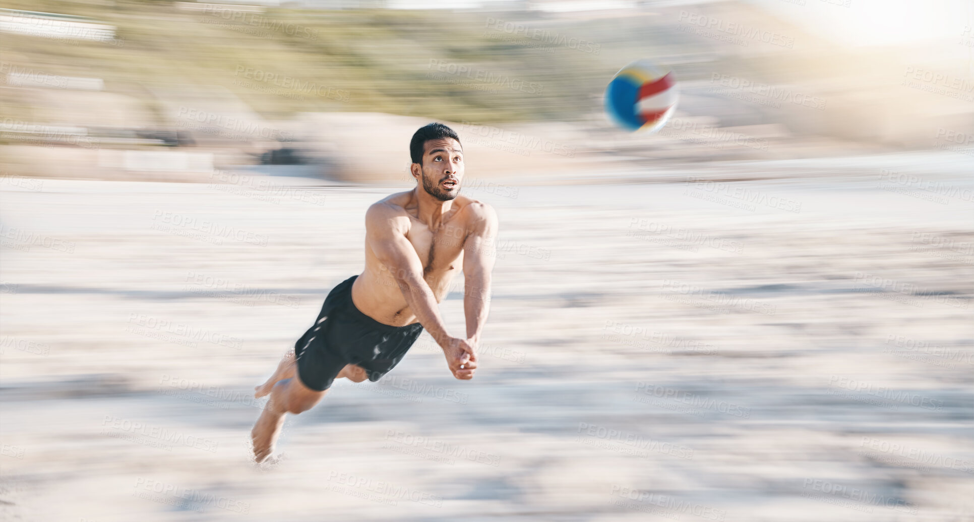 Buy stock photo Sports, beach and man diving for volleyball, fun competition and contest with motion blur. Strong male person jump in air to hit ball at sea for fitness, outdoor summer games or action of performance