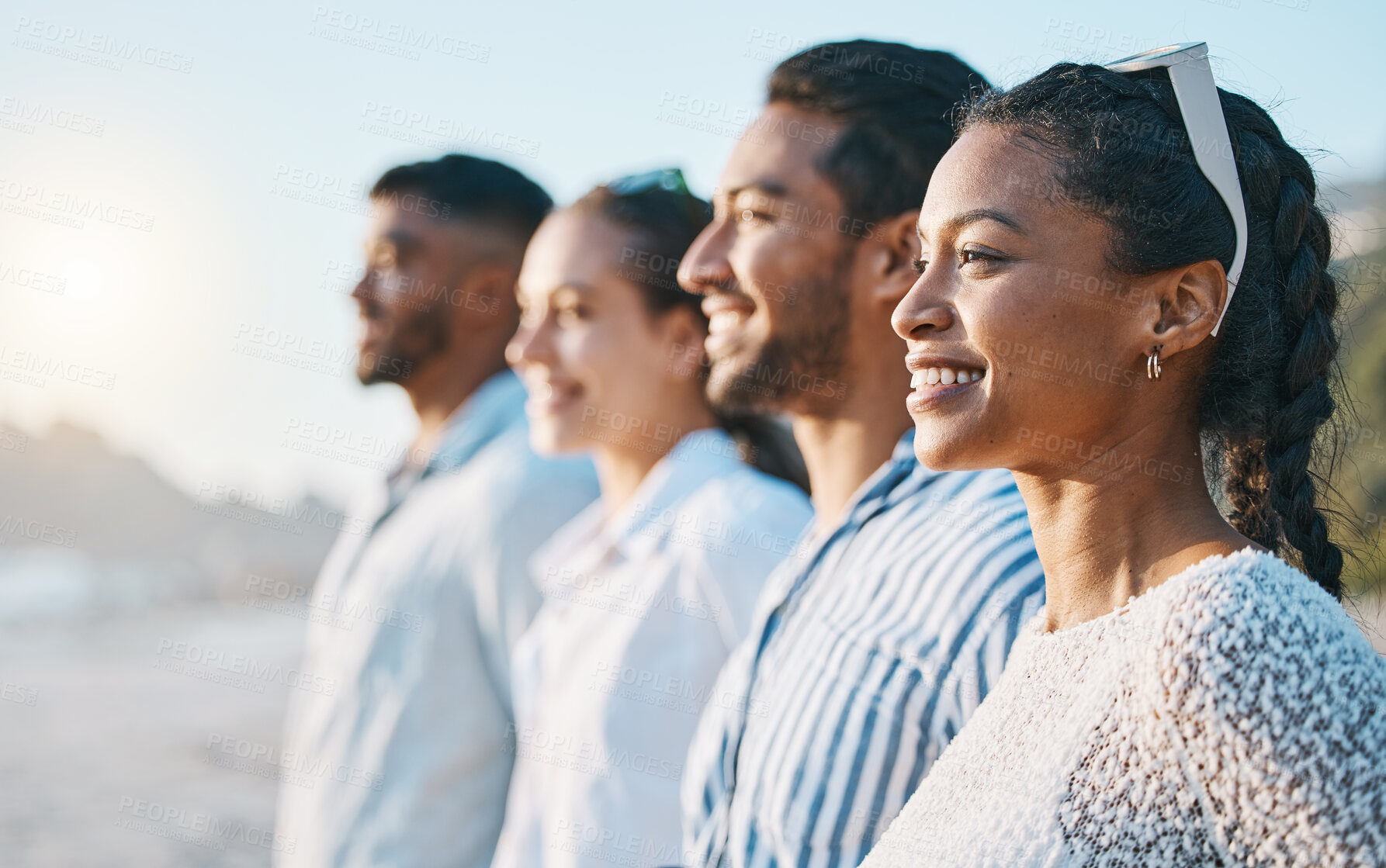 Buy stock photo Happy, line and friends at the beach for sunset together for bonding, vacation or freedom. Smile, community and people in a row at the ocean during vacation for fun, weekend or summer in Bali