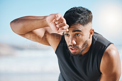 Buy stock photo Tired, sweating and fitness break for man outdoor after training, running or cardio workout on blurred background. Sweat, face and Indian male runner with sports fatigue, dehydration from exercise