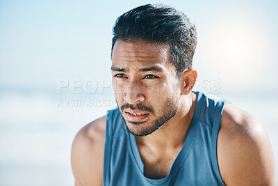 Buy stock photo Fitness, break and man breathing at the beach after training, running and intense cardio, focus and resting. Face, breathe and Mexican male runner stop to breathe during cardio workout at the sea