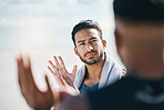 Sign language, communication and friends talking on the beach during summer vacation or holiday together. Face, conversation and travel with a young man chatting outdoor in nature by the ocean