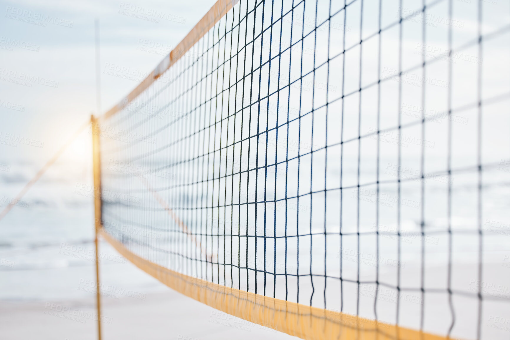 Buy stock photo Background, volleyball and closeup of net at beach for fun competition, contest and flare in sunshine. Sports posts, barrier and rope design at sea for outdoor summer games, match or team performance
