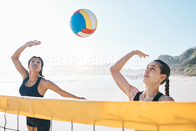 Woman, volleyball and teamwork in sports game, match or competition together by net in the outdoors. Female person, friends or team playing volley reaching for ball in fitness or athletics in nature