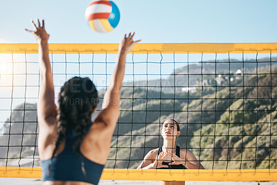 Buy stock photo Volleyball, women and spike, net with sports and fitness outdoor, playing game at the beach at summer. Exercise, female athlete and match with ball and active, workout and action with tournament