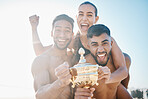 Winning, portrait and volleyball team on the beach with a trophy for goals, success or achievement. Happy, celebrate and group of athletes in unity together by ocean or sea on a summer weekend trip.