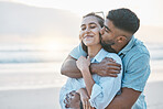 Couple, hug and kiss on beach with love, travel and holiday with mockup space and happy together outdoor. Summer, support and care with affection, man and woman in nature with adventure by the ocean