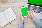 Technology, hands of woman with smartphone and green screen on laptop with notebook for research. Planning or mockup space, online communication or internet and top view of female person at office