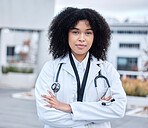 Portrait, woman and doctor with arms crossed, healthcare and success with career, outdoor and life insurance. Face, female person and medical professional with wellness, motivation and proud expert