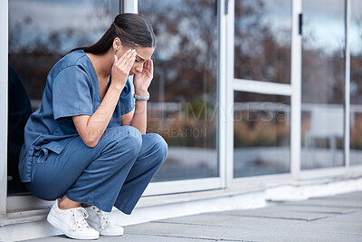 Buy stock photo Anxiety, doctor or a woman with a headache from healthcare, surgery mistake or death at a hospital. Sad, depressed and a tired female nurse with a migraine or burnout from medical career at a clinic