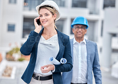Buy stock photo Architect woman, phone call and walking in city, networking and chat with partner, blueprint or negotiation. Architecture team, diversity and smartphone with paperwork, listening and outdoor in metro