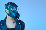 Mockup, protection and woman with a gas mask, breathing equipment and air pollution against a blue studio background. Female person, model and face cover with climate change, filter and radioactive