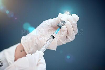 Buy stock photo Closeup, hands and vial with medicine, injection and needle with a doctor on a blue studio background. Zoom, gloves and medical professional with healthcare, needle and vaccine with pharma research