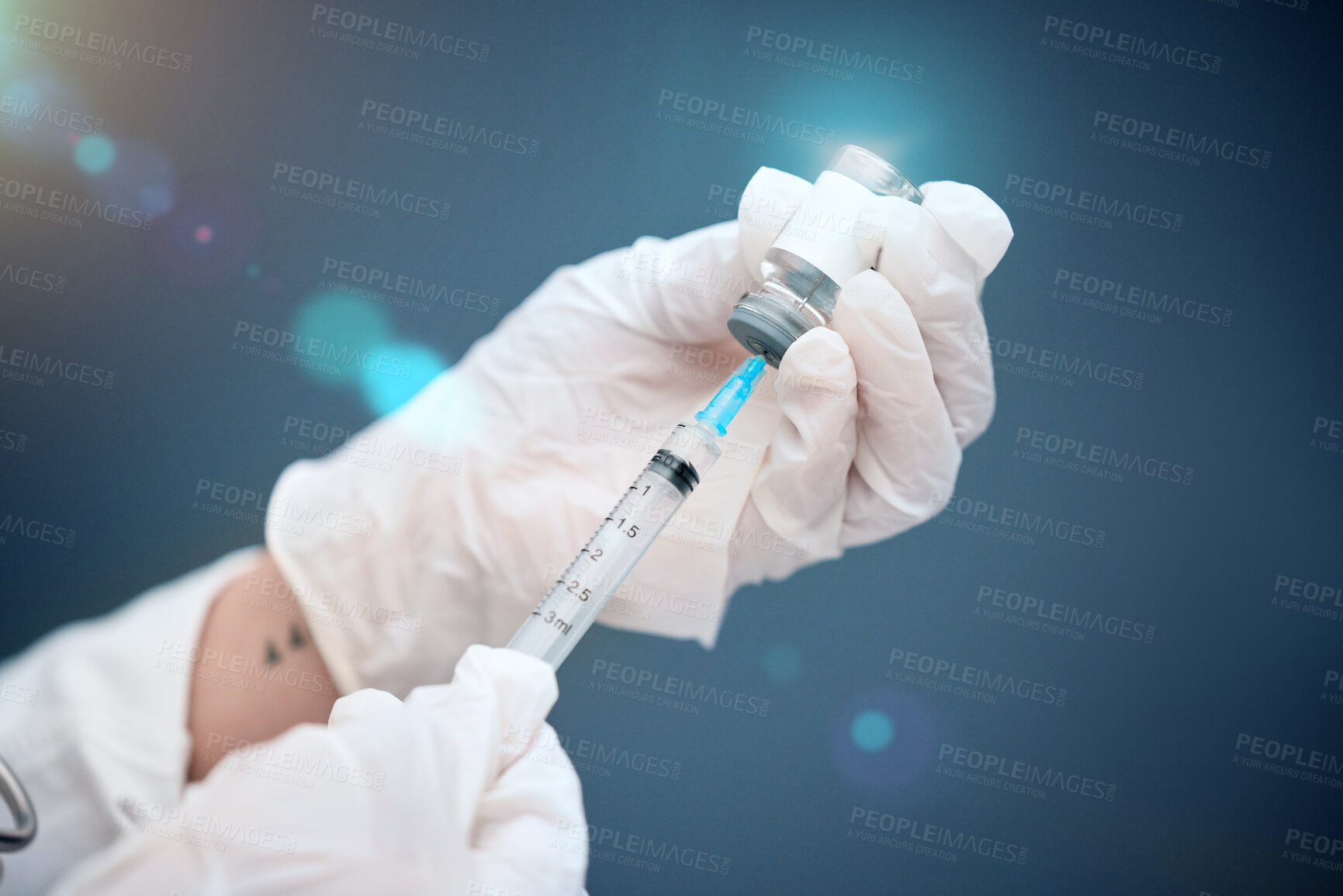Buy stock photo Closeup, hands and vial with medicine, injection and needle with a doctor on a blue studio background. Zoom, gloves and medical professional with healthcare, needle and vaccine with pharma research