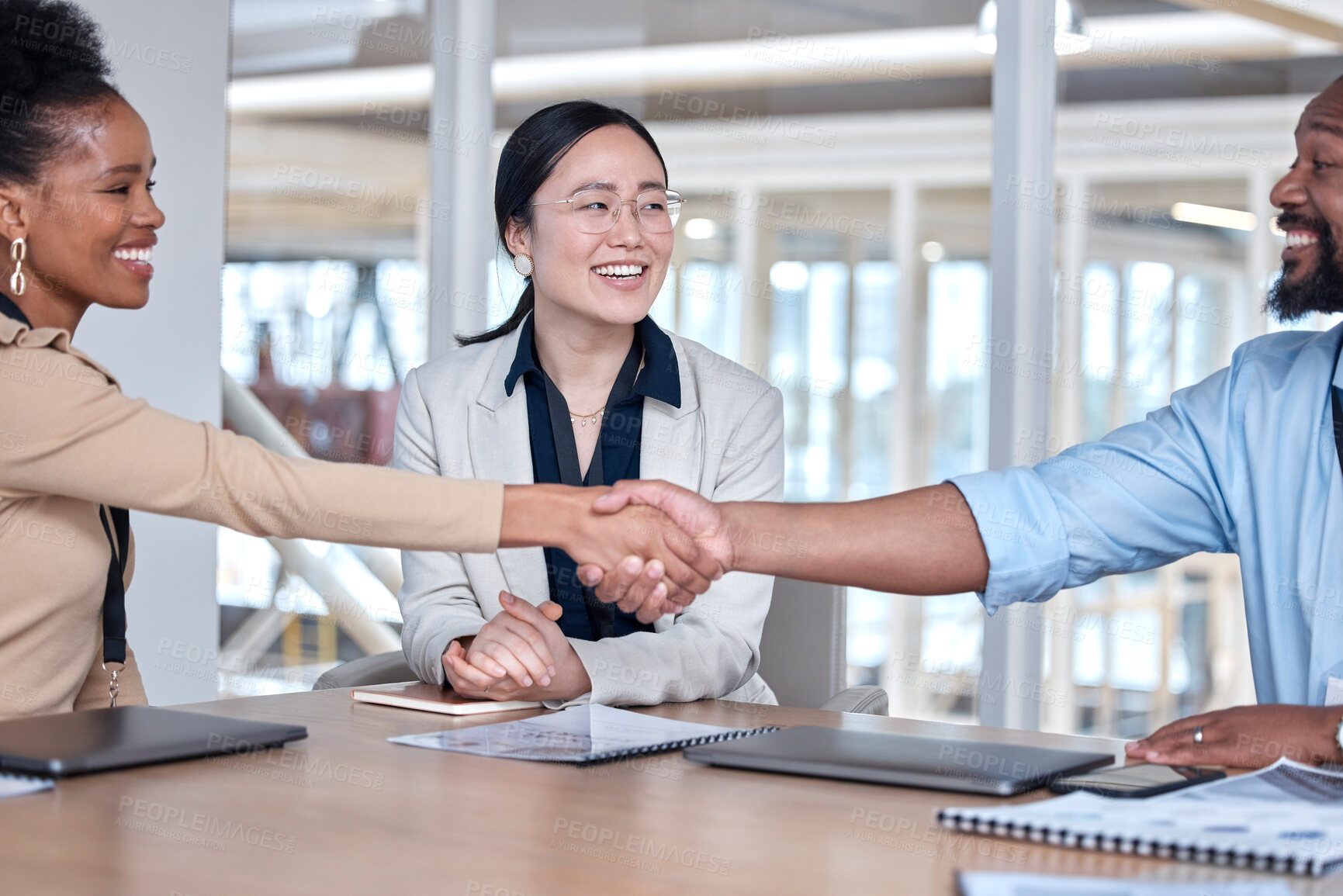 Buy stock photo Business people, man and woman with handshake in meeting for onboarding, deal or happy for teamwork. Shaking hands, team and diversity at hiring, solidarity or congratulations for achievement at job