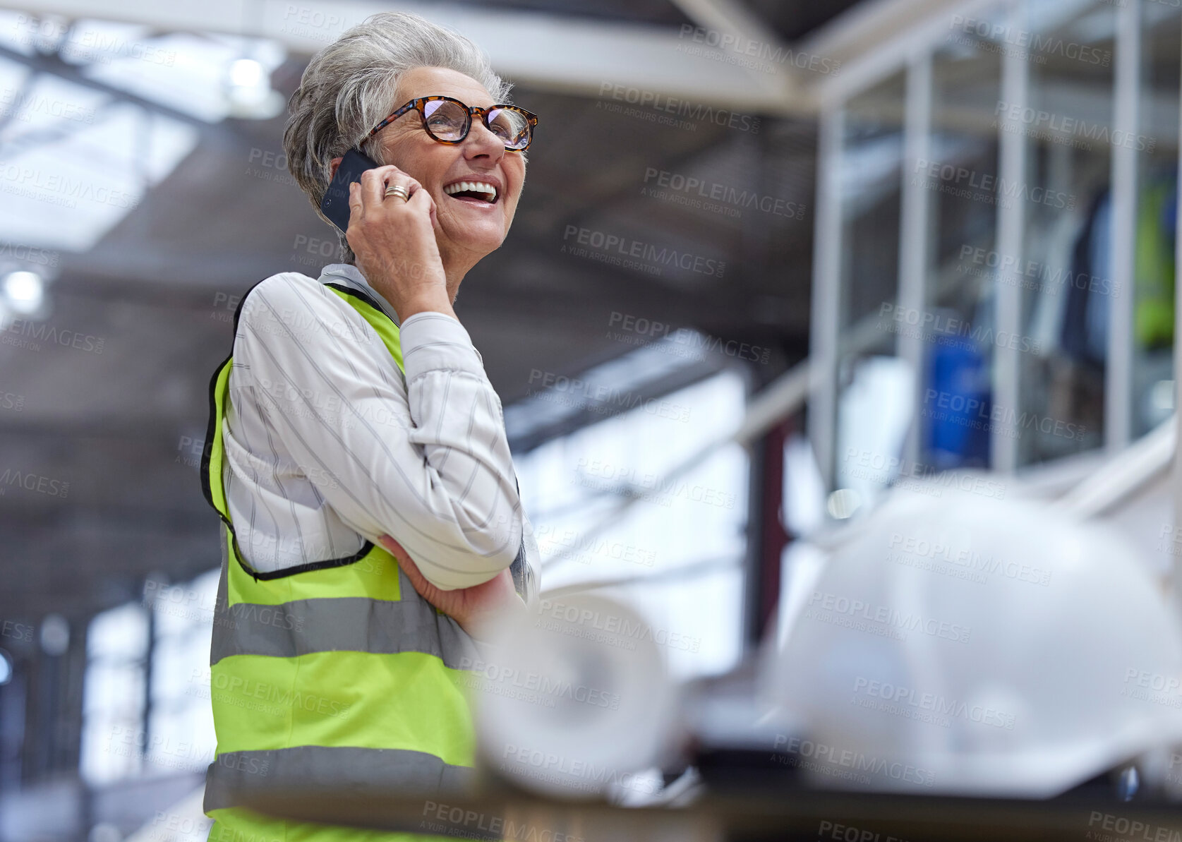 Buy stock photo Phone call, senior woman and architect in funny conversation, planning and work on construction project. Elderly engineer, mobile and manager speaking to contact, communication and laugh in industry.