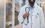 Hospital, doctor and hands of black man with stethoscope for cardiology, consulting and medical service. Healthcare, clinic and closeup of male health worker with equipment for support, exam and help