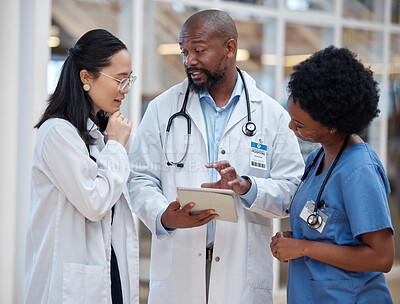 Buy stock photo Doctors, medical and healthcare team work on paperwork or planning in a hospital and talking about medicine strategy. Document, diversity and professional group in discussion or conversation