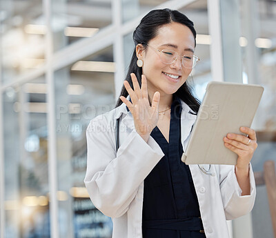 Buy stock photo Video call, wave and doctor with tablet in hospital lobby, digital communication and happiness in Japan. Smile, healthcare and hello, happy Asian woman in clinic with app for telehealth and medicine.