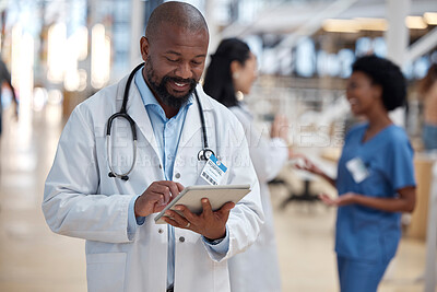Buy stock photo Doctor, black man and tablet for medical planning, data research or healthcare app in busy hospital. Happy male surgeon, digital technology and consulting information on telehealth schedule in clinic